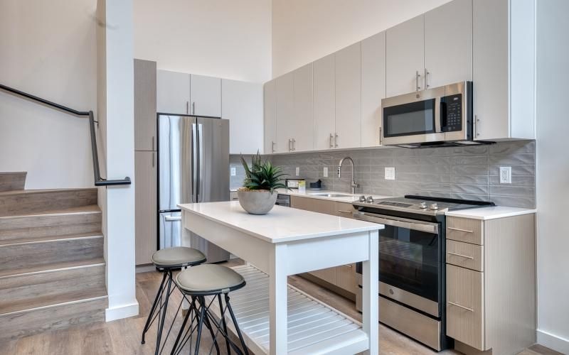 a kitchen with white cabinets