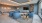 a room with blue chairs and a table
