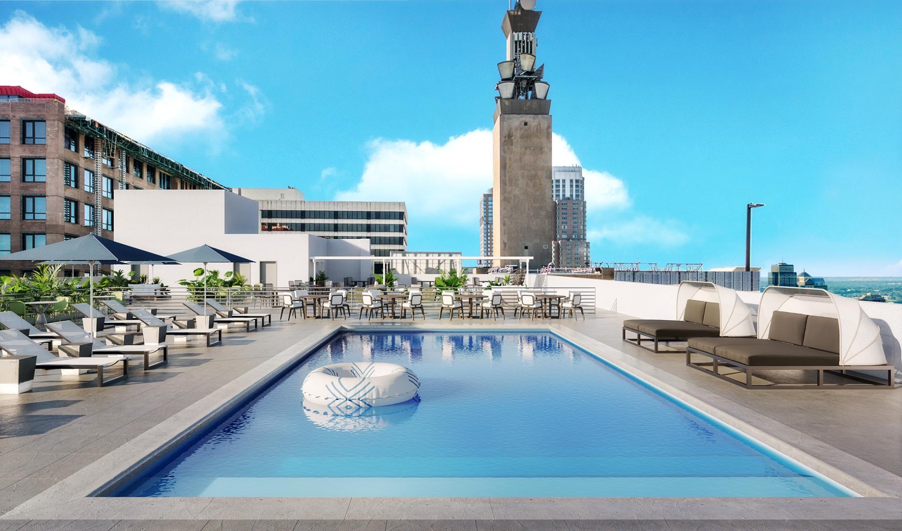 Shimmering resort-style pool a pool with a tower in the background