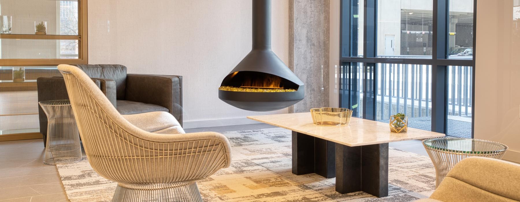 a lounge with a fireplace and seating