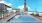 a pool with a tower in the background