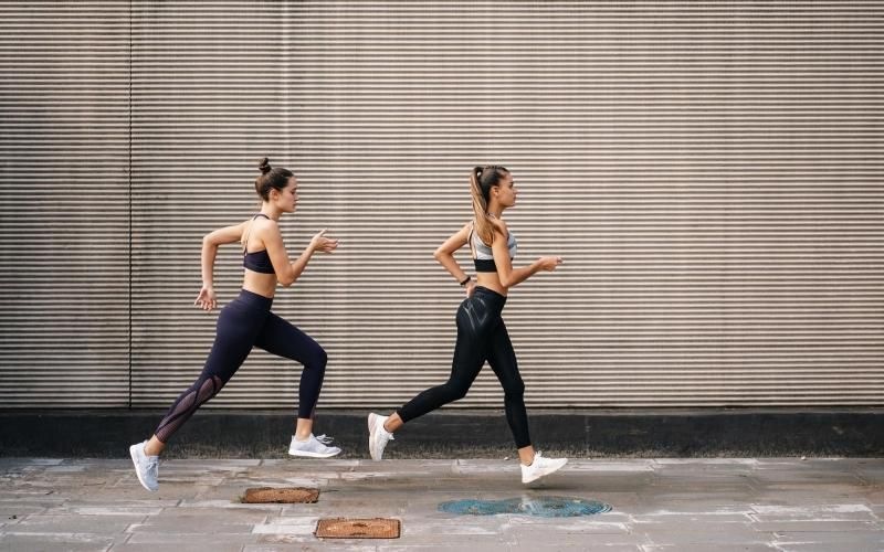 A perfect fit for the whole family two women running on a street