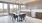 a kitchen with a large table and chairs